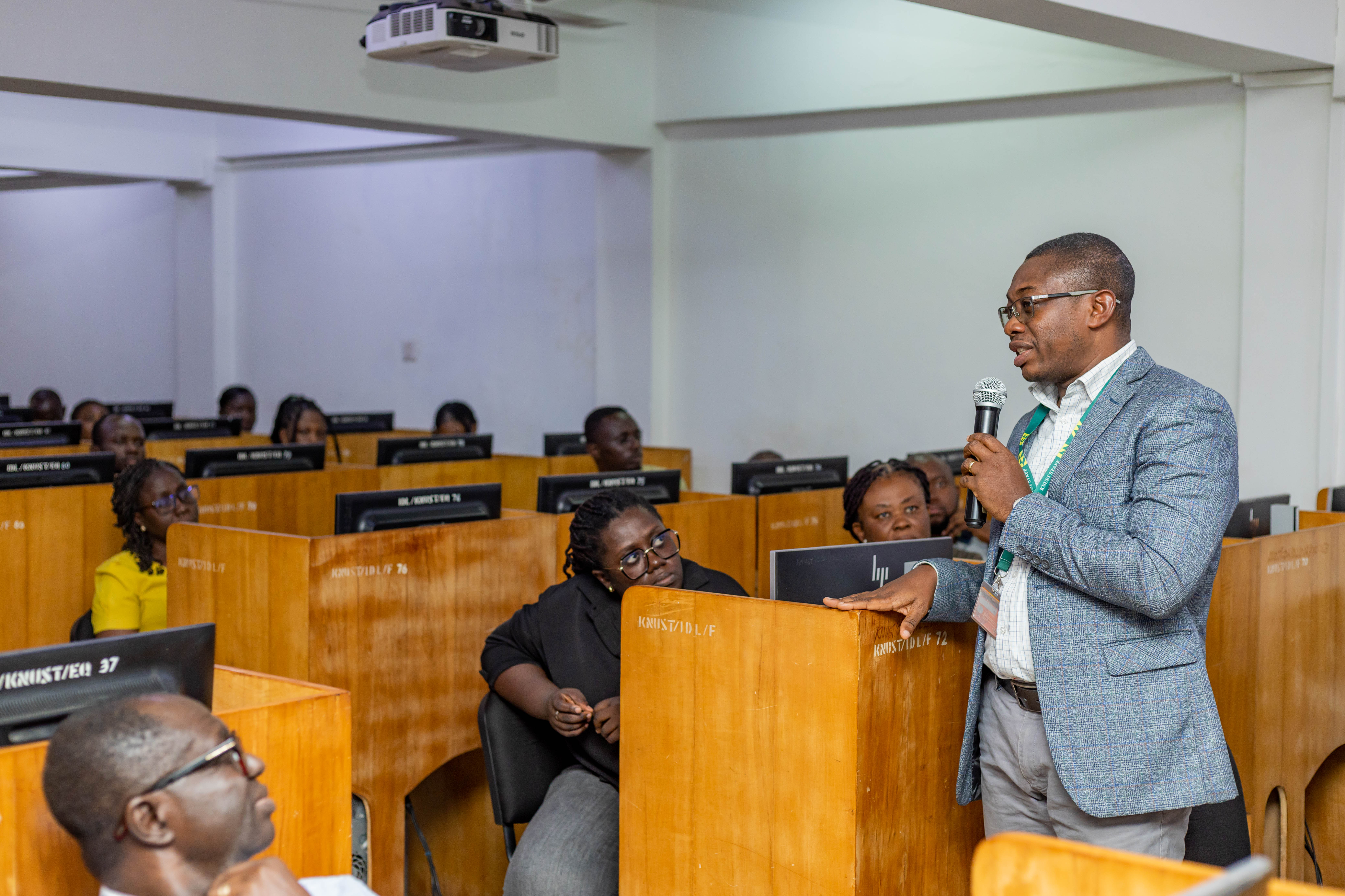 Prof. Andrews interacting with staff